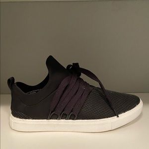 Black slip on casual sneakers.